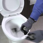 How Plumbers Unclog a Toilet